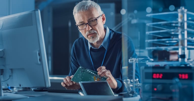 engineer checking circuit board